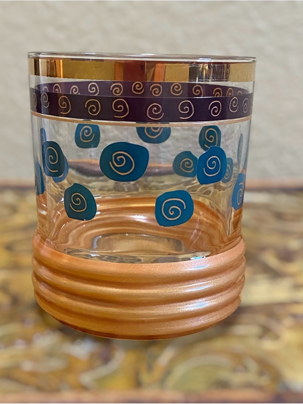 Sakura Gold-Trimmed Glass Tumbler with Teal Spirals and Copper Base